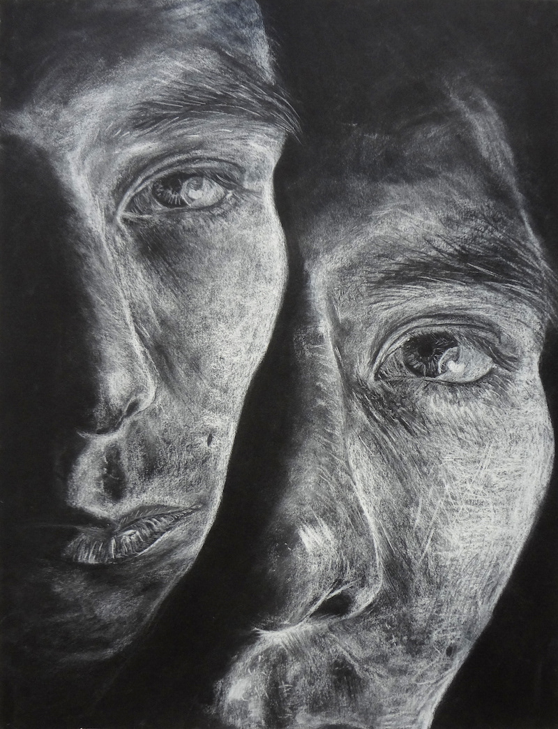 tyrien fixico's face in white charcoal and white conte on black paper