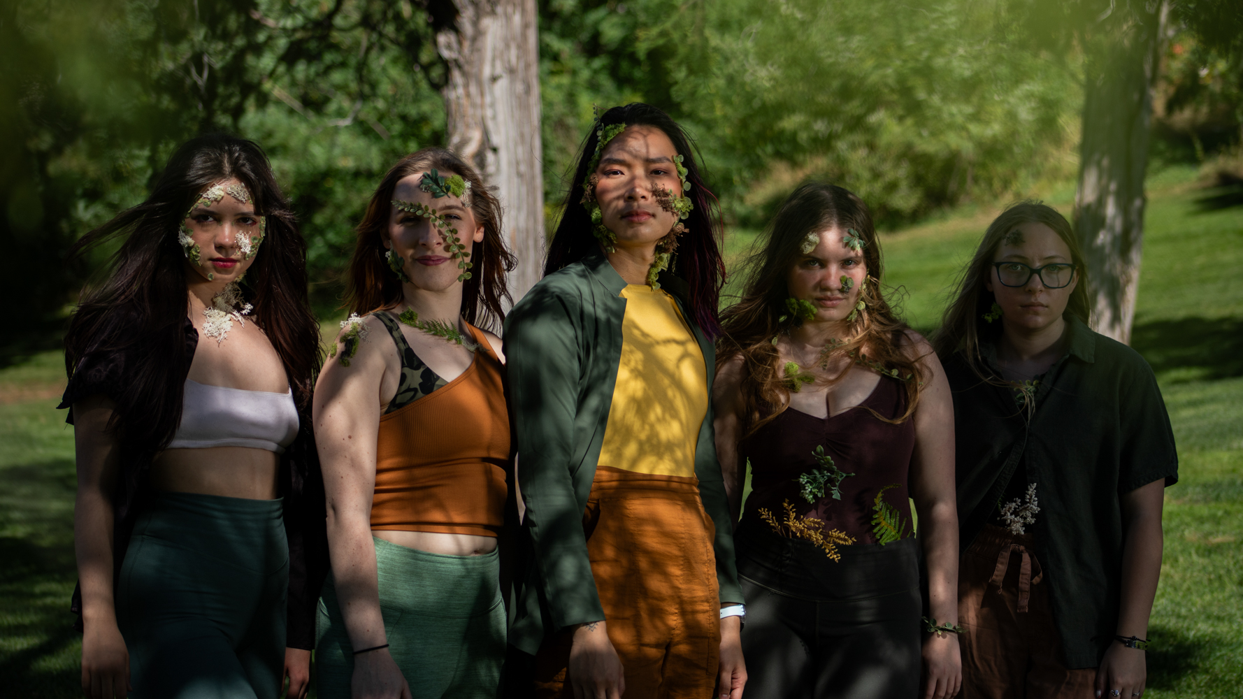 PPSC dance company members dressed as forest fae posing for a group photo at a park during the filming of Epiphyllum.